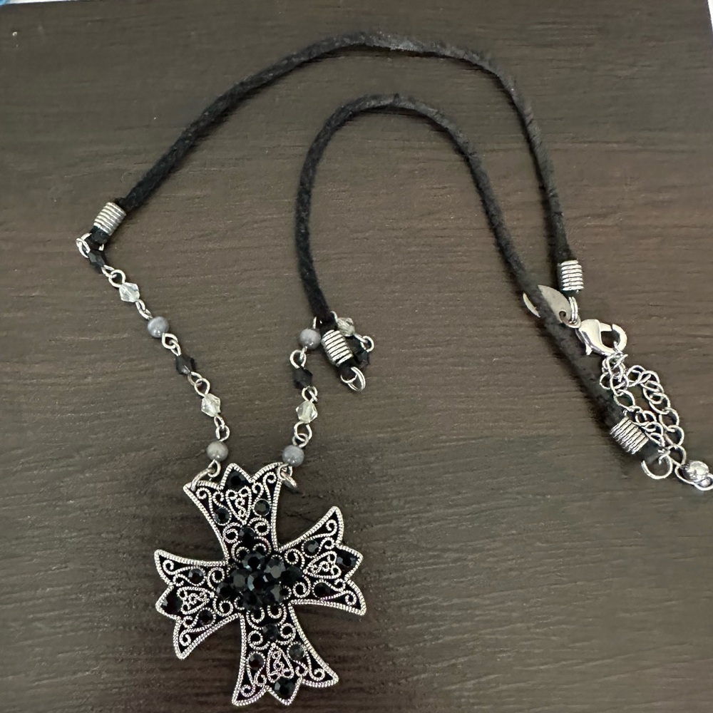 Silpada.925 sterling silver Black and Silver Cross Pendant on a black cord